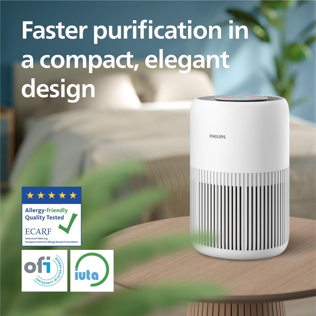 Philips 900 Series AC0950 air purifier standing in an open-plan living room